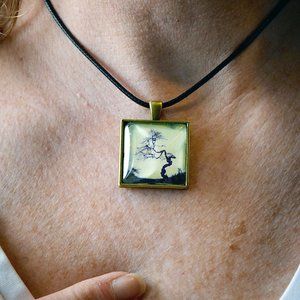 'ANCIENT BABY' PENDANT -- PHOTOGRAPHY BY VIOLET BIGGS